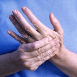woman rubbing her hand